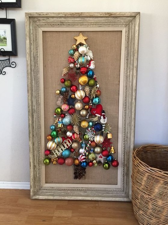 a Christmas tree wall art of bright vintage Christmas ornaments is a super cool and bold idea to repeat