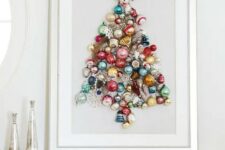 a beautiful colorful Christmas tree made of ornaments on a sign is a chic idea of an additional Christmas tree