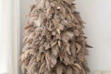 a boho pampas grass Christmas tree decorated with feathers and dried grasses is a lovely idea for a boho feel in the space