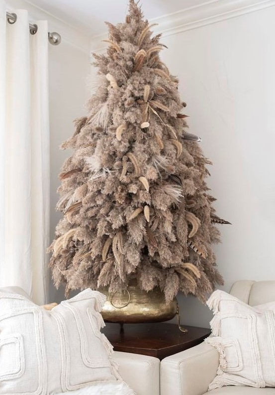 a boho pampas grass Christmas tree decorated with feathers and dried grasses is a lovely idea for a boho feel in the space