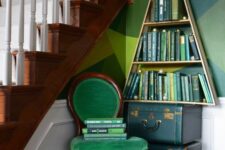 a bookshelf shaped as a Christmas tree, green books inside make it look more like a real Christmas tree