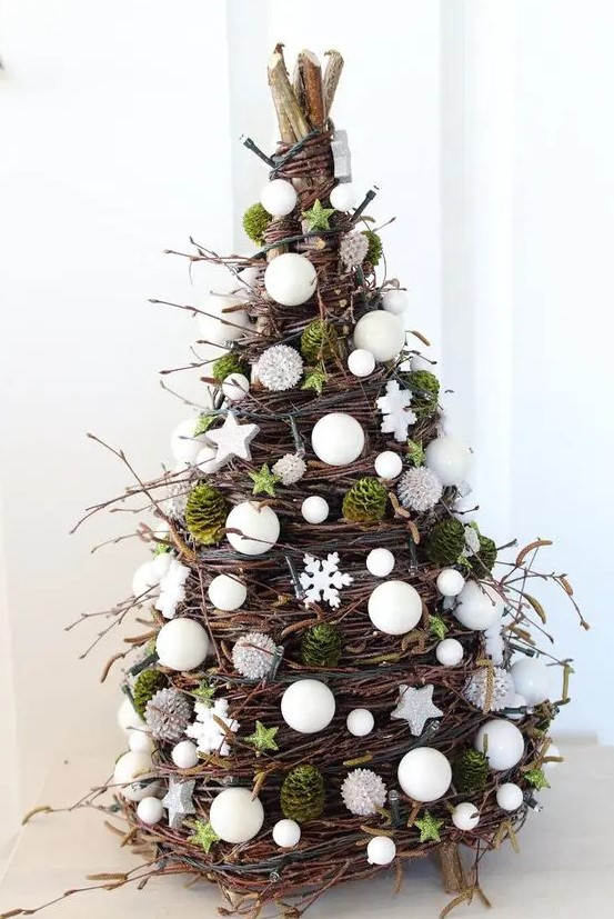 a cone-shaped Christmas tree made of twigs, vine, moss, white beads, stars and pearls is an amazing idea for the holidays