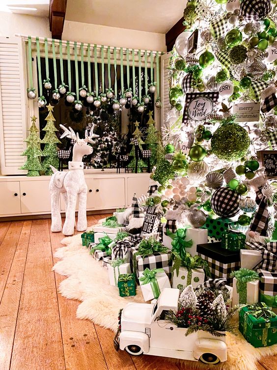 a crazy Christmas tree with buffalo check, green, white, metallic ornaments and ribbons, lights and gift boxes