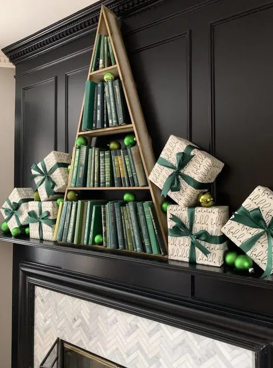 a creative book Christmas mantel with printed gift boxes with green ornaments and a Christmas tree holding green books