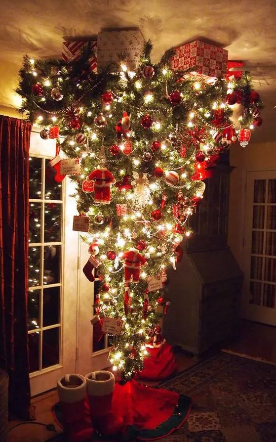 a jaw dropping upside down Christmas tree with silver and red ornaments, letters, beaded garlands and little Santa Claus figurines