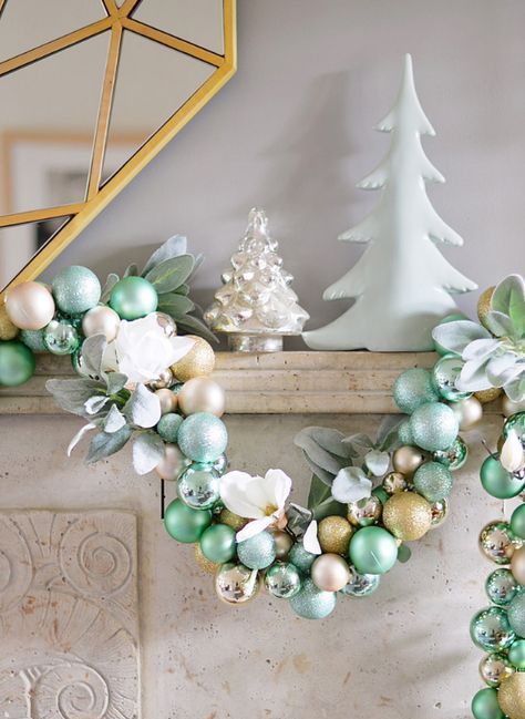 a lovely light green, gold and silver ornament garland with leaves and white blooms is a chic and stylish idea for Christmas
