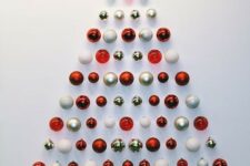 a simple and stylish red, gold and white Christmas ornament tree is a lovely idea for a small space or as alternative