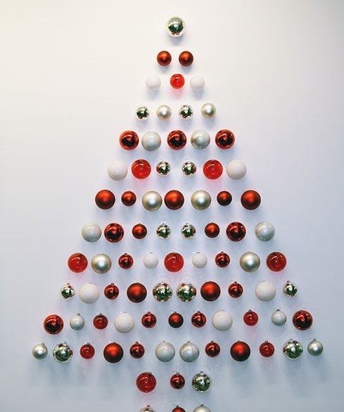 a simple and stylish red, gold and white Christmas ornament tree is a lovely idea for a small space or as alternative
