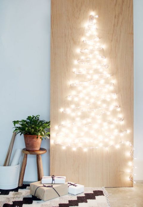 a string light Christmas tree is always a good idea and it's easy to make yourself, you will need only plywood, lights and nails