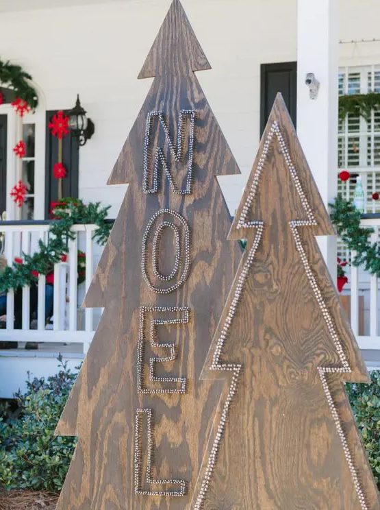plywood Christmas trees decorated with nail heads will be a nice idea for any outdoor space