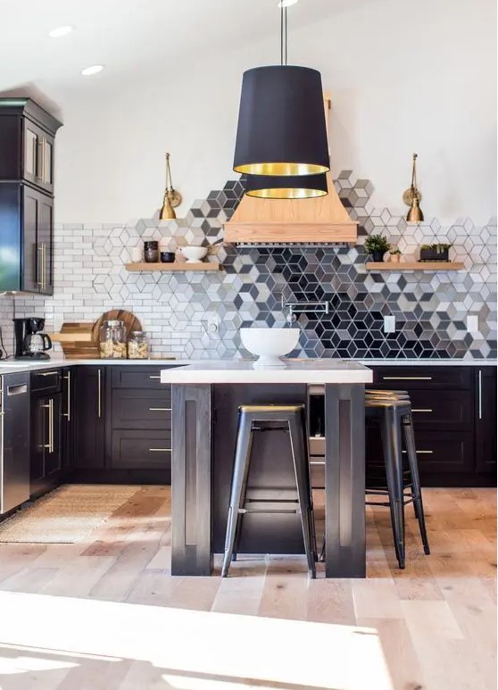 a black kitchen with a beautiful geometric ombre tile backsplash that is a whole masterpiece in here