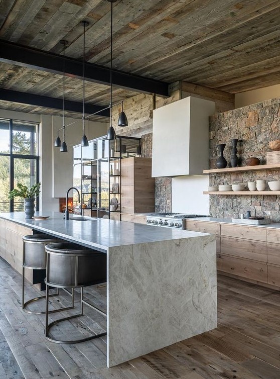a contemporary chalet kitchen with a stone wall, a reclaimed wood ceiling, stone countertops and a modern black chandelier