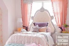 a fun and cool girl’s room with a refined bed with an extended headboard, mirror nightstands and blooms, purple and blush bedding and a turquoise bench