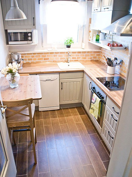 https://www.digsdigs.com/photos/2012/02/a-neutral-farmhouse-kitchen-with-butcherblock-countertops-a-red-brick-backsplash-and-a-tiny-woodne-table.jpg