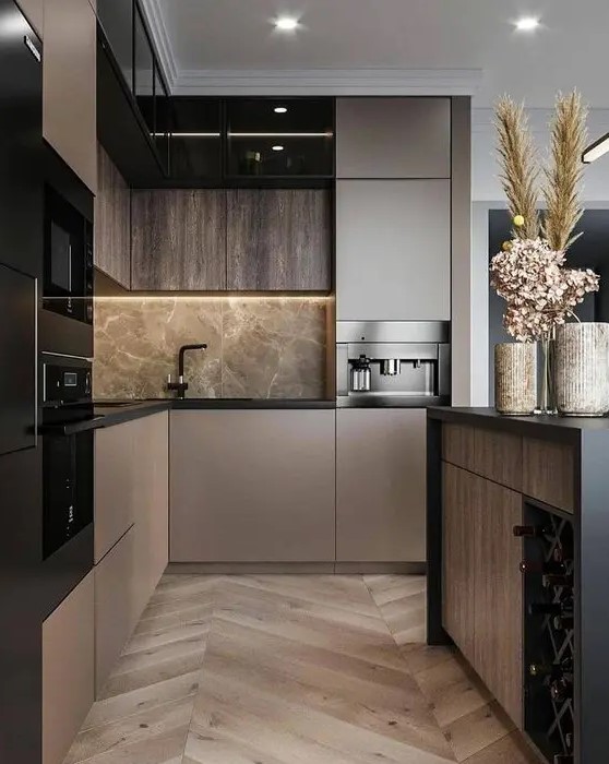 a sophisticated taupe contemporary kitchen with dark stained and taupe cabinets, grey marble and black fixtures plus black built-in appliances