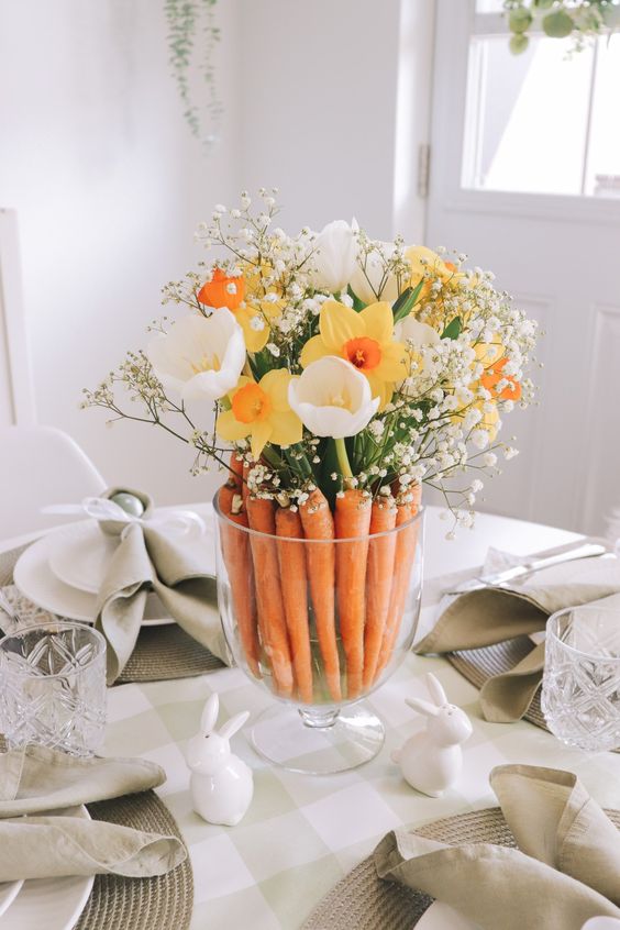 a cool last-minute Easter centerpiece of carrots, white tulips, daffodils and baby's breath is a super cool arrangement