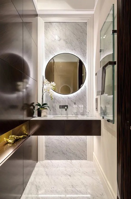 a dark wooden wall and a matching sink vanity together with marble look awesome