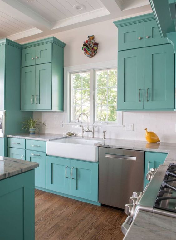 a fun turquoise and white kitchen with a yellow accent is a lovely idea for a beach house or just for a seaside home