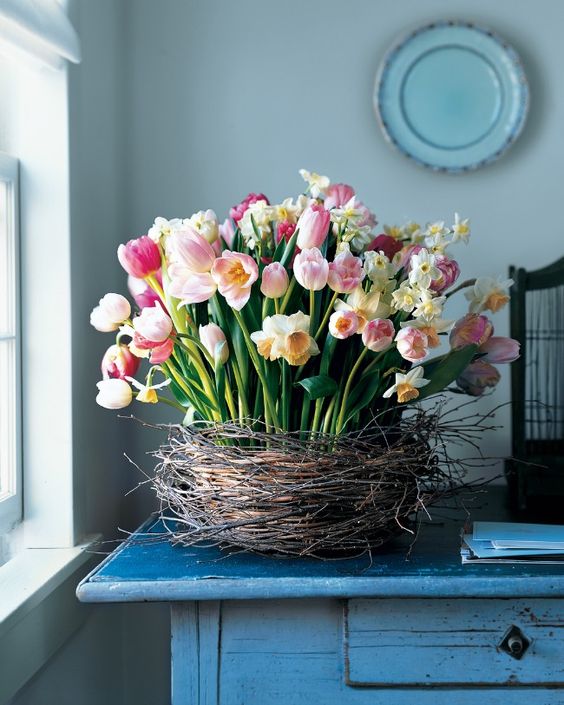 a lovely nest centerpiece of white and blush tulips is a cool idea for spring and Easter