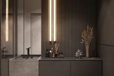 a minimalist black powder room with matte walls and wooden slats, a built-in vanity, lights and a mirror
