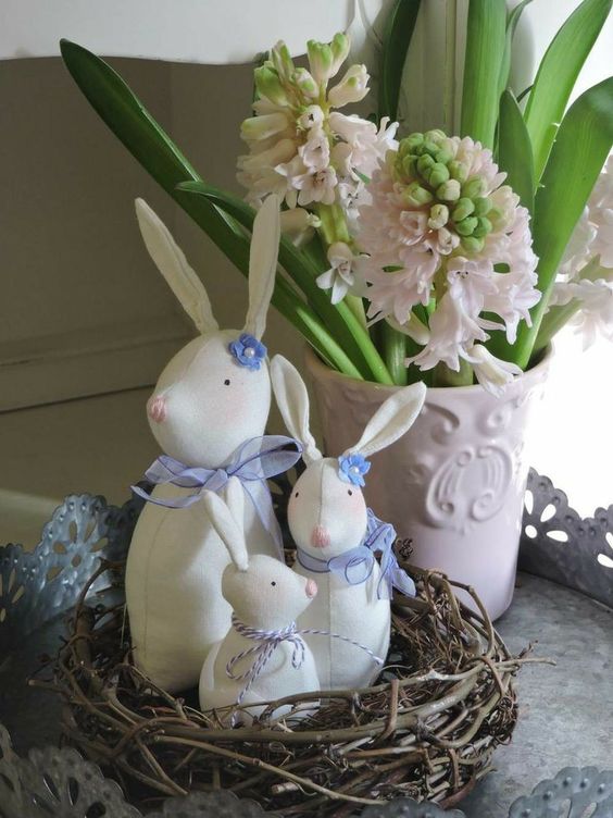 a nest with super cute bunnies can be used for Easter decor indoors and outdoors, for a mantel or console