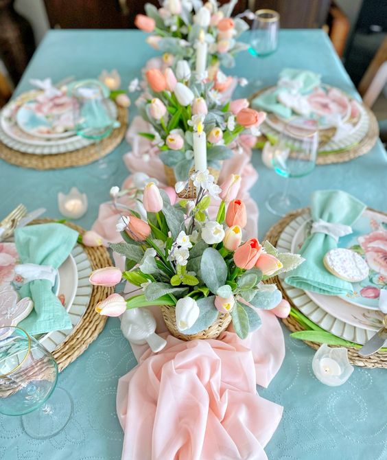 a pastel floral centerpiece of tulips and greenery is an ultimate idea for spring and Easter