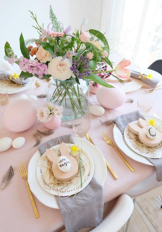 a spring or Easter centerpiece of blush, pink and lilac blooms, textural greenery is amazing for your tablescape