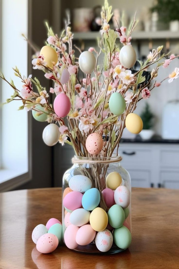 an Easter centerpiece of a jar with pastel eggs, blooming branches with eggs is a cool decoration to rock
