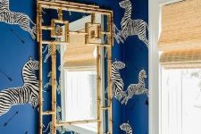 a stylish powder room with a animal wallpaper