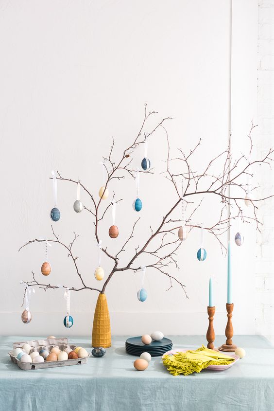 branches with various fake eggs and ribbon are a lovely decoration or centerpiece for spring and Easter