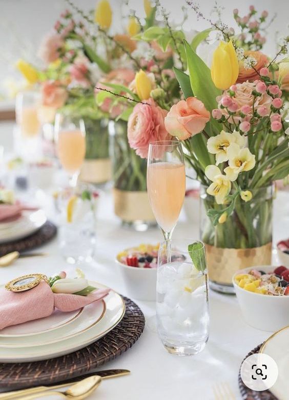 elegant spring or Easter centerpieces of pink and yellow blooms, blooming branches and greenery are super cool