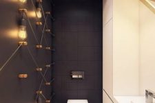 matte black tiles and a black matte wall with bulbs all over create a chic and bold modern look