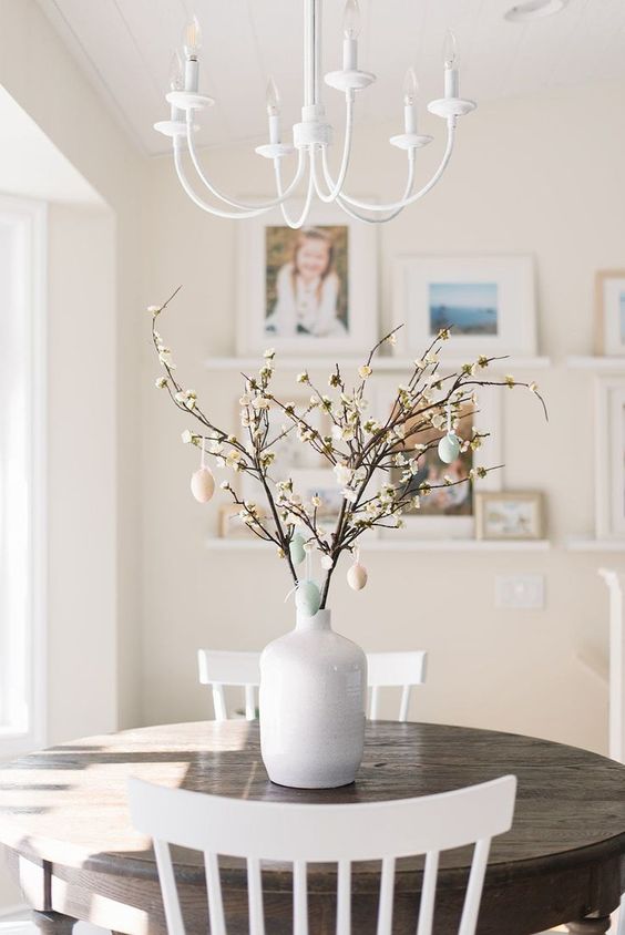 real blooming branches with pastel fake eggs are a cool spring or Easter decoration you can make