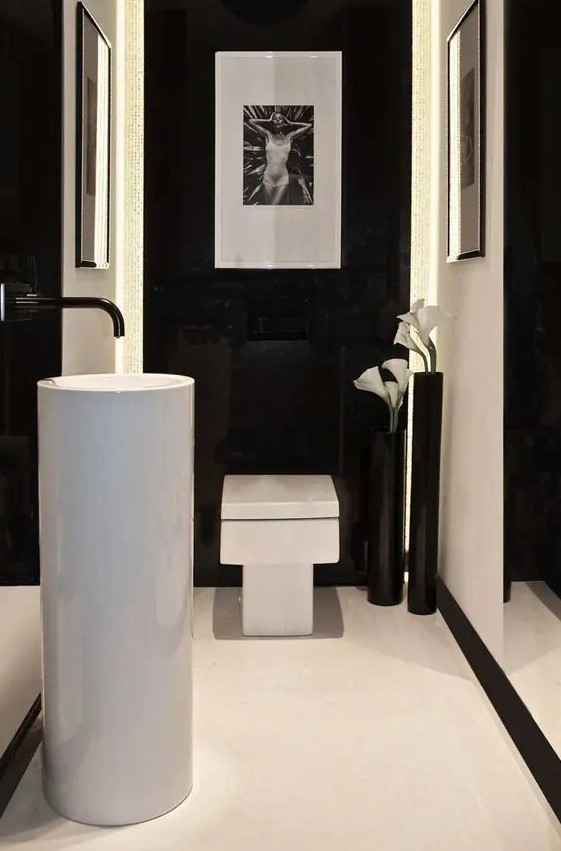 shiny black walls with white parts make the space luxurious and minimalist and bold