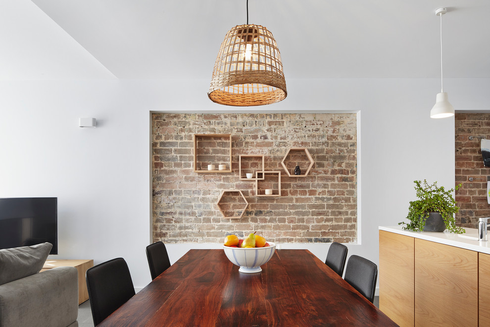 Geometric timber wall shelves combined with exposed bricks are definitely a focal point of this loft-like room.