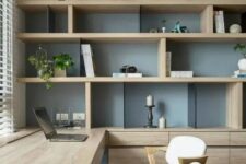 a chic contemporary home office with a storage unit that takes a whole wall, with open and closed storage compartments, a built-in desk and chic modern chairs