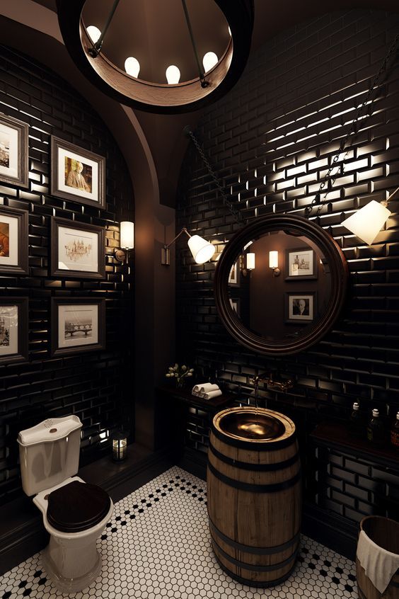 a Victorian bathroom with black subway tiles, a barrel vanity, a round mirror on chains, a gallery wall and a chandelier