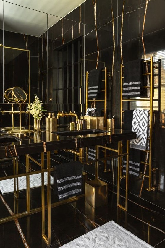 a luxurious black and gold bathroom design