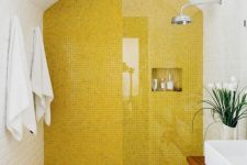 a modern bathroom with a lemon yellow tile shower and floor plus all white around looks bright and very fresh