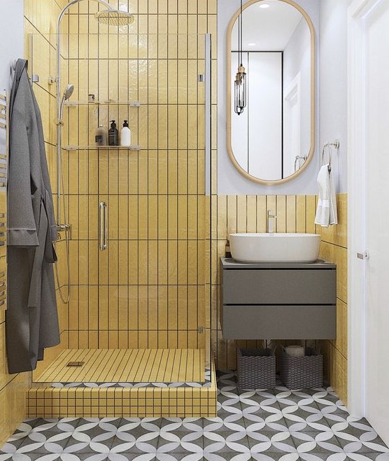 a small minimalist bathroom with a shower clad with mustard skinny tiles and white and grey for a contrast