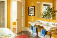 a vintage-inspired mustard bathroom with white for a fresh look, vintage appliances and fixtures