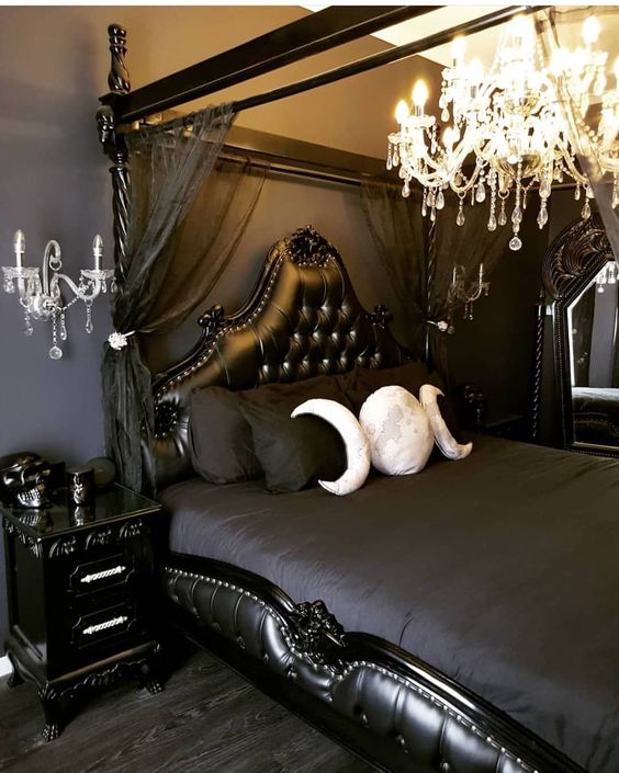 a beautiful Gothic bedroom with black walls, refined furniture, dark bedding, a crystal chandelier and wall sconces (photo by little_lady_wolf)