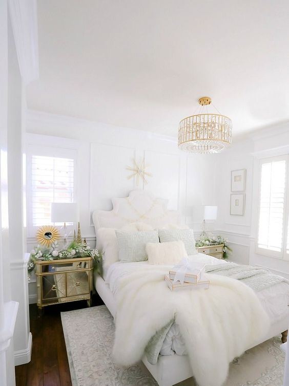 49 Glamorous Bedroom Design Ideas - A Beautiful Glam BeDroom In Neutrals With A GolD AnD Crystal ChanDelier RefineD Furniture A Mirror NightstanD AnD Rugs