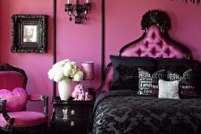 a girlish Gothic bedroom with pink walls and furniture, black touches from drama – a black chandelier, bedding and frames