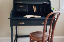 a vintage working spot with a navy bureau desk and a stained chair some art and greenery is a lovely idea for your home