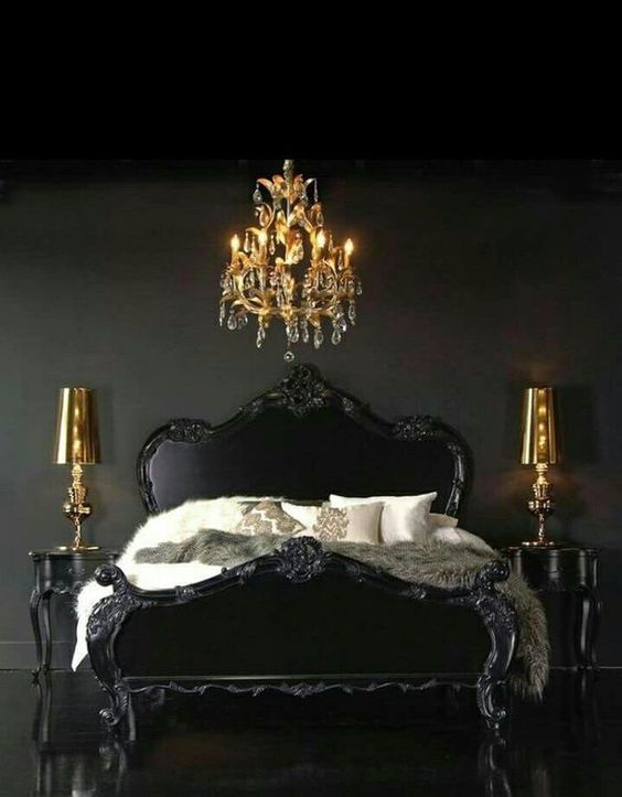 an exquisite Gothic-inspired bedroom in black, with refined furniture and gold lamps and a chandelier is statement-like