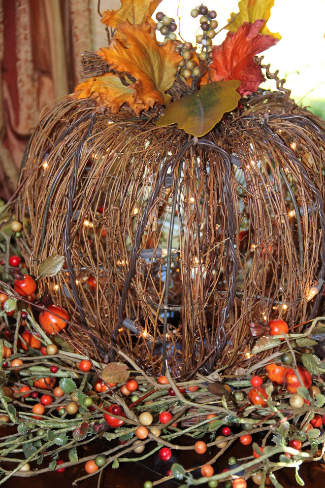 Light up your faux twig pumpkin with Christmas lights.