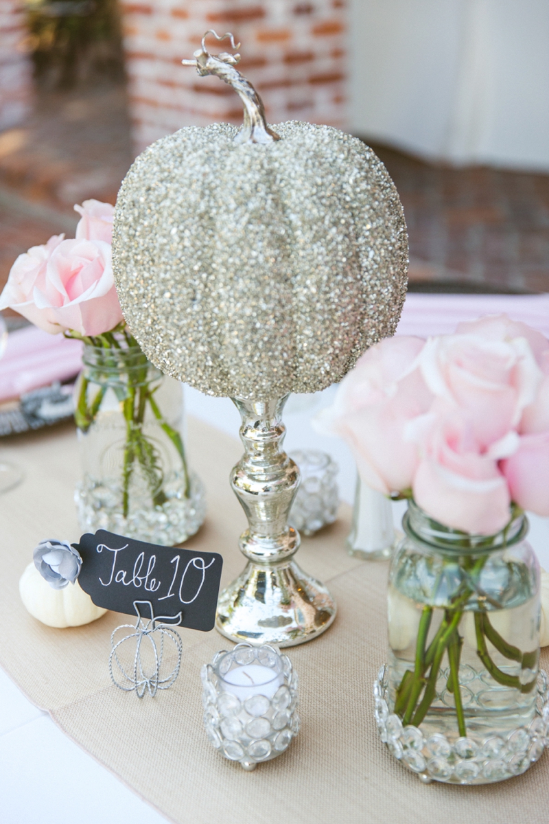 For a Fall or Halloween wedding decorate your tables with pumpkins covered with glitter to add a glamorous touch.