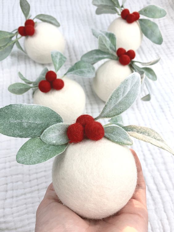 a white felt ball Christmas ornament with berries and leaves is a lovely and chic idea to enjoy