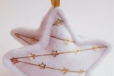white felt stars with gold embroidery are lovely and chic Christmassy ornaments you can easily make